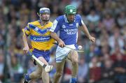 26 June 2004; Damien Culleton, Laois, is tackled by Alan Markham, Clare. Guinness Senior Hurling Championship Qualifier, Round 1, Clare v Laois, Gaelic Grounds, Limerick. Picture credit; Ray McManus / SPORTSFILE