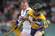 26 June 2004; Frank Lohan, Clare, is tackled by Kevin Galvin, Laois. Guinness Senior Hurling Championship Qualifier, Round 1, Clare v Laois, Gaelic Grounds, Limerick. Picture credit; Pat Murphy / SPORTSFILE
