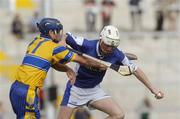 26 June 2004; Tommy Fitzgerald, Laois, is tackled by Gerry O'Grady, Clare. Guinness Senior Hurling Championship Qualifier, Round 1, Clare v Laois, Gaelic Grounds, Limerick. Picture credit; Ray McManus / SPORTSFILE