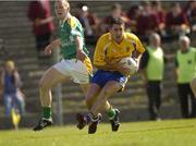 26 June 2004; Frankie Dolan, Roscommon, in action against Michael McGuinness, Leitrim. Bank of Ireland Connacht Senior Football Championship Semi-Final Replay, Roscommon v Leitrim, Dr. Hyde Park, Co. Roscommon. Picture credit; Damien Eagers / SPORTSFILE