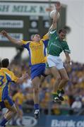 26 June 2004; Seamus O'Neill, Roscommon, in action against Declan Maxwell, Leitrim. Bank of Ireland Connacht Senior Football Championship Semi-Final Replay, Roscommon v Leitrim, Dr. Hyde Park, Co. Roscommon. Picture credit; Damien Eagers / SPORTSFILE