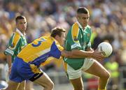 26 June 2004; Jimmy Guckian, Leitrim, in action against Michael Ryan, Roscommon. Bank of Ireland Connacht Senior Football Championship Semi-Final Replay, Roscommon v Leitrim, Dr. Hyde Park, Co. Roscommon. Picture credit; Damien Eagers / SPORTSFILE
