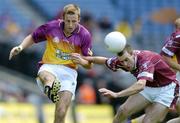 27 June 2004; David Fogarty, Wexford, in action against Michael Ennis, Westmeath. Bank of Ireland Leinster Senior Football Championship Semi-Final, Wexford v Westmeath, Croke Park, Dublin. Picture credit; David Maher / SPORTSFILE