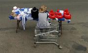 27 June 2004;  A 'Hat or Flags' seller awaits customers on the way to the game. Guinness Munster Senior Hurling Championship Final, Cork v Waterford, Semple Stadium, Thurles, Co. Tipperary. Picture credit; Ray McManus / SPORTSFILE