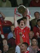27 June 2004; The Cork captain Shane O'Neill lifts the cup. . Munster Minor Hurling Championship Final, Tipperary v Cork, Semple Stadium, Thurles, Co. Tipperary. Picture credit; Ray McManus / SPORTSFILE