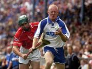 27 June 2004; John Mullane, Waterford, in action against Brian Murphy, Cork. Guinness Munster Senior Hurling Championship Final, Cork v Waterford, Semple Stadium, Thurles, Co. Tipperary. Picture credit; Pat Murphy / SPORTSFILE