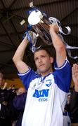 27 June 2004; Waterford captain Ken McGrath lifts the cup after victory over Cork. Guinness Munster Senior Hurling Championship Final, Cork v Waterford, Semple Stadium, Thurles, Co. Tipperary. Picture credit; Pat Murphy / SPORTSFILE
