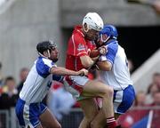 27 June 2004; Timmy McCarthy, Cork, is tackled by Waterford players Tony Browne, left, and Declan Prendergast. Guinness Munster Senior Hurling Championship Final, Cork v Waterford, Semple Stadium, Thurles, Co. Tipperary. Picture credit; Ray McManus / SPORTSFILE