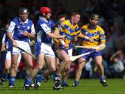 26 June 2004; Diarmuid McMahon, Clare, in action against James Young, Laois. Guinness Senior Hurling Championship Qualifier, Round 1, Clare v Laois, Gaelic Grounds, Limerick. Picture credit; Ray McManus / SPORTSFILE