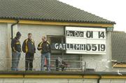 26 June 2004; The scoreboard attendents check the amount of time left in the game on a mobile phone. Guinness Senior Hurling Championship Qualifier, Round 1, Down v Galway, McKenna Park, Ballycran, Co. Down. Picture credit; Brendan Moran / SPORTSFILE