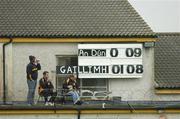 26 June 2004; The scoreboard attendents enjoy a half-time break. Guinness Senior Hurling Championship Qualifier, Round 1, Down v Galway, McKenna Park, Ballycran, Co. Down. Picture credit; Brendan Moran / SPORTSFILE