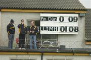 26 June 2004; The scoreboard attendents enjoy a half-yime break. Guinness Senior Hurling Championship Qualifier, Round 1, Down v Galway, McKenna Park, Ballycran, Co. Down. Picture credit; Brendan Moran / SPORTSFILE
