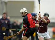 26 June 2004; Gabriel Clarke, Down, in action against Kevin Broderick and Eugene Cloonan, Galway. Guinness Senior Hurling Championship Qualifier, Round 1, Down v Galway, McKenna Park, Ballycran, Co. Down. Picture credit; Brendan Moran / SPORTSFILE