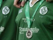 27 June 2004; A member of the Irish team with his runner's up, silver medal, after Ireland were defeated by New Zealand. IRB U21 World Championship Final, Ireland v New Zealand, Hughenden, Glasgow, Scotland. Picture credit; Brendan Moran / SPORTSFILE