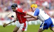 27 June 2004; Ben O'Connor, Cork, in action against Eoin Murphy, Waterford. Guinness Munster Senior Hurling Championship Final, Cork v Waterford, Semple Stadium, Thurles, Co. Tipperary. Picture credit; Ray McManus / SPORTSFILE