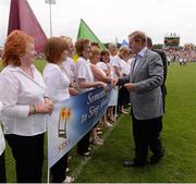 21 July 2013; An Taoiseach Enda Kenny T.D. meets singers from the 'Something to Sing About' group. Connacht GAA Football Senior Championship Final, Mayo v London, Elverys MacHale Park, Castlebar, Co. Mayo. Picture credit: Ray McManus / SPORTSFILE