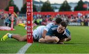 30 August 2013; Ronan O'Mahony, Munster, scores his side's first try despite the efforts of Guy Armitage, London Irish. Pre-Season Friendly, Munster v London Irish, Musgrave Park, Cork. Picture credit: Diarmuid Greene / SPORTSFILE