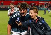 30 August 2013; A young Munster supporter takes a photo of himself with Munster's Donncha O'Callaghan after the game. Pre-Season Friendly, Munster v London Irish, Musgrave Park, Cork. Picture credit: Diarmuid Greene / SPORTSFILE