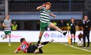 26 June 2023; Rory Gaffney of Shamrock Rovers is tackled by Cameron Dummigan of Derry City during the SSE Airtricity Men's Premier Division match between Shamrock Rovers and Derry City at Tallaght Stadium in Dublin. Photo by Stephen McCarthy/Sportsfile