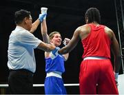 27 June 2023; Aoife O'Rourke of Ireland, centre, celebrates after being declared the winner against Cindy Winner Djankeu Ngamba of EOC Refugee Team in their Women's 75kg Round of 16 bout at the Nowy Targ Arena during the European Games 2023 in Krakow, Poland. Photo by Tyler Miller/Sportsfile