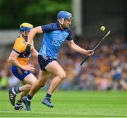 24 June 2023; Paul Crummey of Dublin is tackled by Seadna Morey of Clare  during the GAA Hurling All-Ireland Senior Championship Quarter Final match between Clare and Dublin at TUS Gaelic Grounds in Limerick. Photo by Ray McManus/Sportsfile