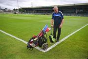 24 June 2023; A member of the grounds staff prepares to place flags around the ground before the GAA Hurling All-Ireland Senior Championship Quarter Final match between Clare and Dublin at TUS Gaelic Grounds in Limerick. Photo by Ray McManus/Sportsfile