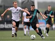 30 June 2023; Aaron Greene of Shamrock Rovers in action against Greg Sloggett of Dundalk during the SSE Airtricity Men's Premier Division match between Dundalk and Shamrock Rovers at Oriel Park in Dundalk, Louth. Photo by Ben McShane/Sportsfile