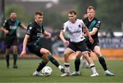 30 June 2023; Johannes Yli-Kokko of Dundalk in action against Sean Hoare, right, and Markus Poom of Shamrock Rovers during the SSE Airtricity Men's Premier Division match between Dundalk and Shamrock Rovers at Oriel Park in Dundalk, Louth. Photo by Ben McShane/Sportsfile