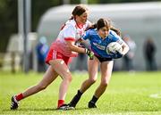 1 July 2023; Ava Mullins of Naomh Mhuire is tackled by Lauren O'Connor of Inch Rovers during the LGFA Division 1 match between Inch Rovers, Cork, and Naomh Mhuire, Galway, at the John West Féile Peile na nÓg National Gaelic football and ladies’ football Finals at the Connacht GAA Centre of Excellence in Bekan, Mayo. Eighty-four club sides took part in the national finals across 10 venues in Connacht. Sponsored for the eighth time by John West, it is one of the biggest underage sporting events on the continent. Photo by Ben McShane/Sportsfile