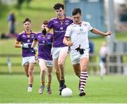 1 July 2023; Eoin Doyle of St. Mary's Athenry in action against Matthew Farrell of Kilmacud Crokes during the John West Féile Peile na nÓg Finals 2023 at the Connacht GAA Centre of Excellence in Bekan, Mayo. Photo by Stephen Marken/Sportsfile