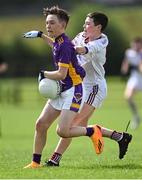 1 July 2023; Michael Barrett of St. Mary's Athenry in action against Cian Manning of Kilmacud Crokes during the John West Féile Peile na nÓg Finals 2023 at the Connacht GAA Centre of Excellence in Bekan, Mayo. Photo by Stephen Marken/Sportsfile