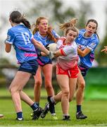 1 July 2023; Orlaith Murphy of Inch Rovers in action against Naomh Mhuire players, from left, Kate Butler, Cara Cormican and Labhaoise Keane during the LGFA Division 1 match between Inch Rovers, Cork, and Naomh Mhuire, Galway, at the John West Féile Peile na nÓg National Gaelic football and ladies’ football Finals at the Connacht GAA Centre of Excellence in Bekan, Mayo. Eighty-four club sides took part in the national finals across 10 venues in Connacht. Sponsored for the eighth time by John West, it is one of the biggest underage sporting events on the continent. Photo by Ben McShane/Sportsfile