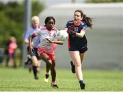1 July 2023; Jane Sugrue of New York in action against Alexis Olaniran of Inch Rovers during the John West Féile Peile na nÓg Finals 2023 at the Connacht GAA Centre of Excellence in Bekan, Mayo. Photo by Stephen Marken/Sportsfile