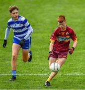 1 July 2023; Aodhan O'Hanlon of Gortnamona in action against Cormac Fitzsimons of Navan O'Mahony's during the John West Féile Peile na nÓg Finals 2023 at the Connacht GAA Centre of Excellence in Bekan, Mayo. Photo by Stephen Marken/Sportsfile