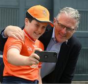1 July 2023; Twelve year old Armagh supporter Niall Doherty, from Mullaghbawn, takes a selfie with Uachtarán Tofa Chumann Lúthchleas Gael Jarlath Burns before the GAA Football All-Ireland Senior Championship quarter-final match between Armagh and Monaghan at Croke Park in Dublin. Photo by Ray McManus/Sportsfile