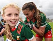 1 July 2023; Aoife Geraghty of Mayo signs an autograph for a young Mayo supporter after the TG4 LGFA All-Ireland Senior Championship match between Mayo and Laois at Hastings Insurance MacHale Park in Castlebar, Mayo. Photo by Tom Beary/Sportsfile