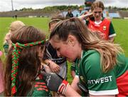 1 July 2023; Aoife Geraghty of Mayo signs autographs for young supporters after the TG4 LGFA All-Ireland Senior Championship match between Mayo and Laois at Hastings Insurance MacHale Park in Castlebar, Mayo. Photo by Tom Beary/Sportsfile