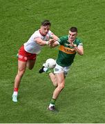 1 July 2023; Sean O'Shea of Kerry is tackled by Michael McKernan of Tyrone during the GAA Football All-Ireland Senior Championship quarter-final match between Kerry and Tyrone at Croke Park in Dublin. Photo by Brendan Moran/Sportsfile