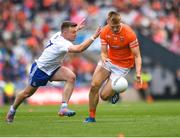1 July 2023; Rian O'Neill of Armagh is tackled by Conor McCarthy of Monaghan during the GAA Football All-Ireland Senior Championship quarter-final match between Armagh and Monaghan at Croke Park in Dublin. Photo by John Sheridan/Sportsfile