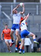 1 July 2023; Gary Mohan of Monaghan wins possession ahead of teammate Darren Hughes and Rian O'Neill of Armagh during the GAA Football All-Ireland Senior Championship quarter-final match between Armagh and Monaghan at Croke Park in Dublin. Photo by Piaras Ó Mídheach/Sportsfile