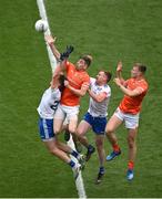 1 July 2023; Andrew Murnin, second from left, and Rian O'Neill of Armagh contest a kickout with Darren Hughes, left, and Kieran Duffy of Monaghan during the GAA Football All-Ireland Senior Championship quarter-final match between Armagh and Monaghan at Croke Park in Dublin. Photo by Brendan Moran/Sportsfile