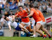 1 July 2023; Karl O'Connell of Monaghan in action against Rian O'Neill, Aidan Forker and Joe McElroy of Armagh during the GAA Football All-Ireland Senior Championship quarter-final match between Armagh and Monaghan at Croke Park in Dublin. Photo by Ray McManus/Sportsfile