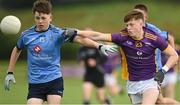 1 July 2023; Dara Dawson of Westport in action against Luke Coffey of Kilmacud Crokes during the John West Féile Peile na nÓg Finals 2023 at the Connacht GAA Centre of Excellence in Bekan, Mayo. Photo by Stephen Marken/Sportsfile