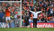 1 July 2023; An umpire signals a wide as Monaghan goalkeeper Rory Beggan celebrates saving the last penalty kick from Callum Cumiskey, left, during the GAA Football All-Ireland Senior Championship quarter-final match between Armagh and Monaghan at Croke Park in Dublin. Photo by Ray McManus/Sportsfile