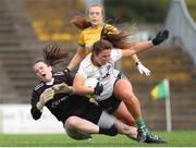1 July 2023; Shauna Ennis of Meath is tackled by Donegal goalkeeper Claire O'Frighil during the TG4 Ladies Football All-Ireland Senior Championship match between Meath and Donegal at Páirc Tailteann in Navan, Meath. Photo by Michael P Ryan/Sportsfile