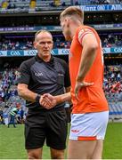 1 July 2023; Referee Conor Lane shakes hands with Armagh captain Rian O'Neill before the GAA Football All-Ireland Senior Championship quarter-final match between Armagh and Monaghan at Croke Park in Dublin. Photo by Piaras Ó Mídheach/Sportsfile