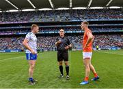 1 July 2023; Referee Conor Lane with team captains Kieran Duffy of Monaghan and Rian O'Neill of Armagh for the coin toss before the GAA Football All-Ireland Senior Championship quarter-final match between Armagh and Monaghan at Croke Park in Dublin. Photo by Piaras Ó Mídheach/Sportsfile
