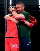 2 July 2023; Nathan Tait of Ireland, left, is embraced by Kickboxing coach Dave Heffernan after his defeat to Martin Balint of Hungary in Men's Point Fighting 74kg Final bout at the Myslenice Arena during the European Games 2023 in Krakow, Poland. Photo by Tyler Miller/Sportsfile
