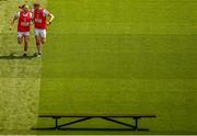 2 July 2023; Brian Hurley, left, and Colm O'Callaghan of Cork make their way to the bench for the team photograph before the GAA Football All-Ireland Senior Championship quarter-final match between Derry and Cork at Croke Park in Dublin. Photo by Brendan Moran/Sportsfile