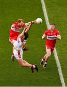 2 July 2023; Colm O'Callaghan of Cork and Conor Glass of Derry contest a high ball during the GAA Football All-Ireland Senior Championship quarter-final match between Derry and Cork at Croke Park in Dublin. Photo by Brendan Moran/Sportsfile
